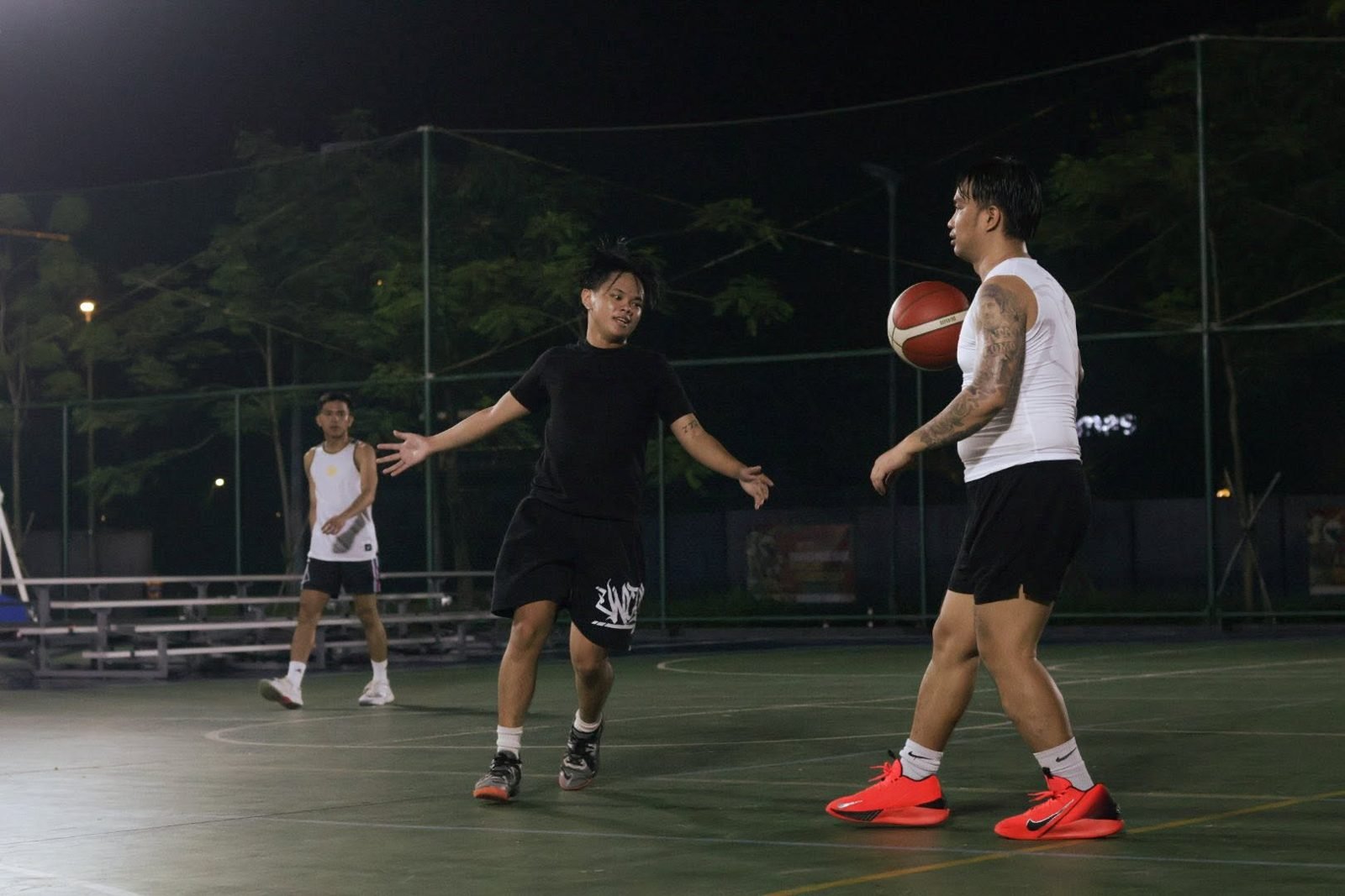 Two players squaring up at a BTC night basketball run